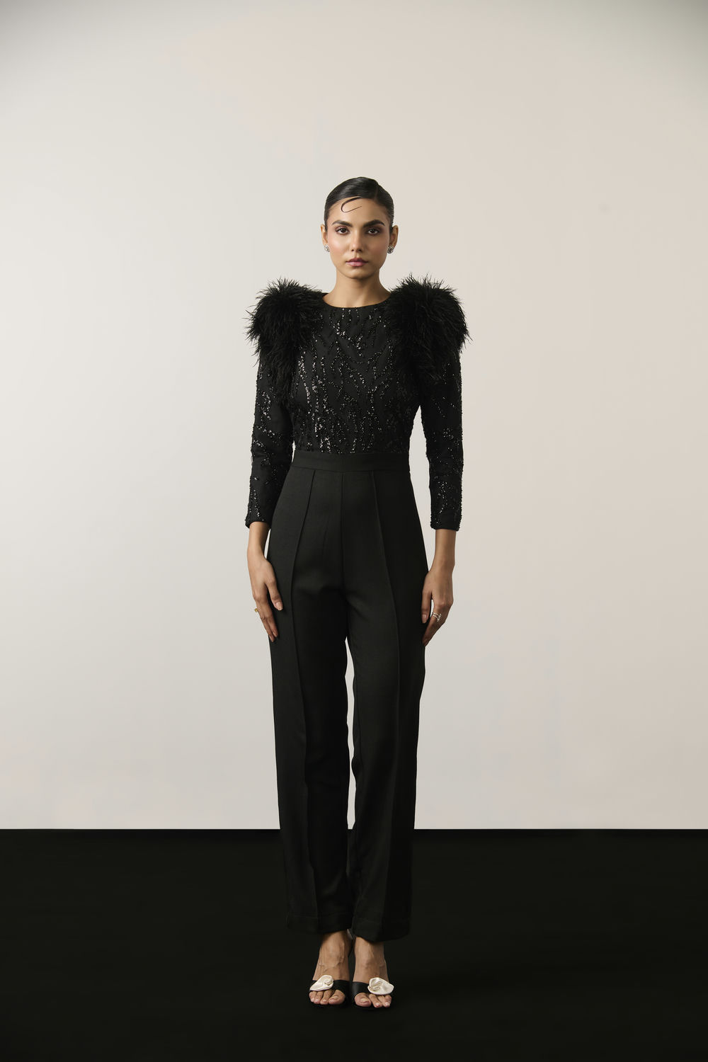 BLACK SEQUIN AND FEATHER JUMPSUIT