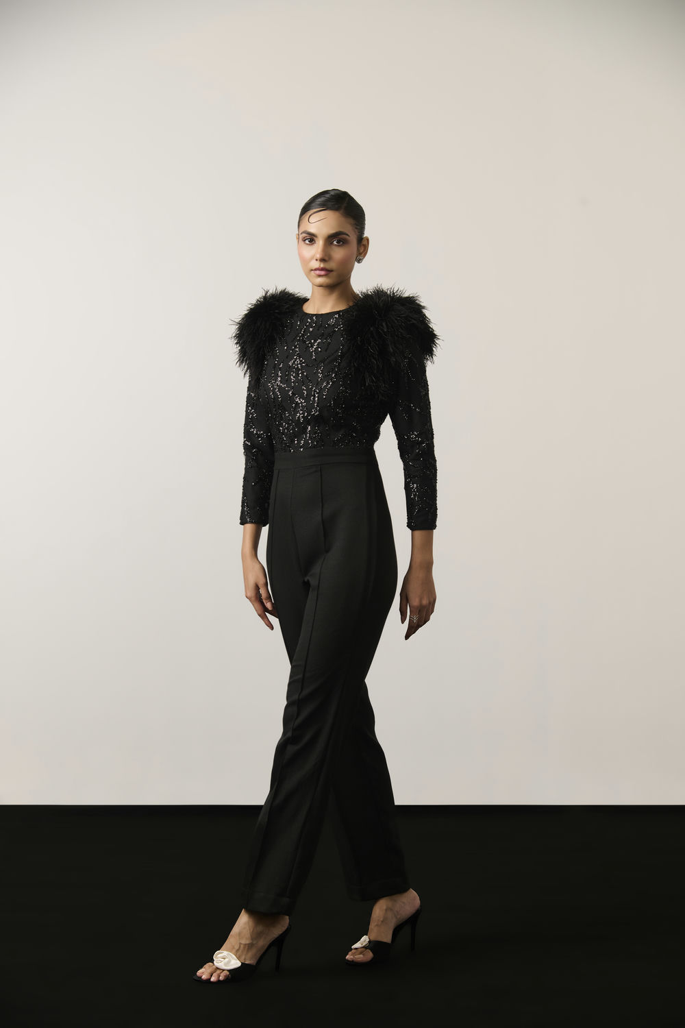 BLACK SEQUIN AND FEATHER JUMPSUIT