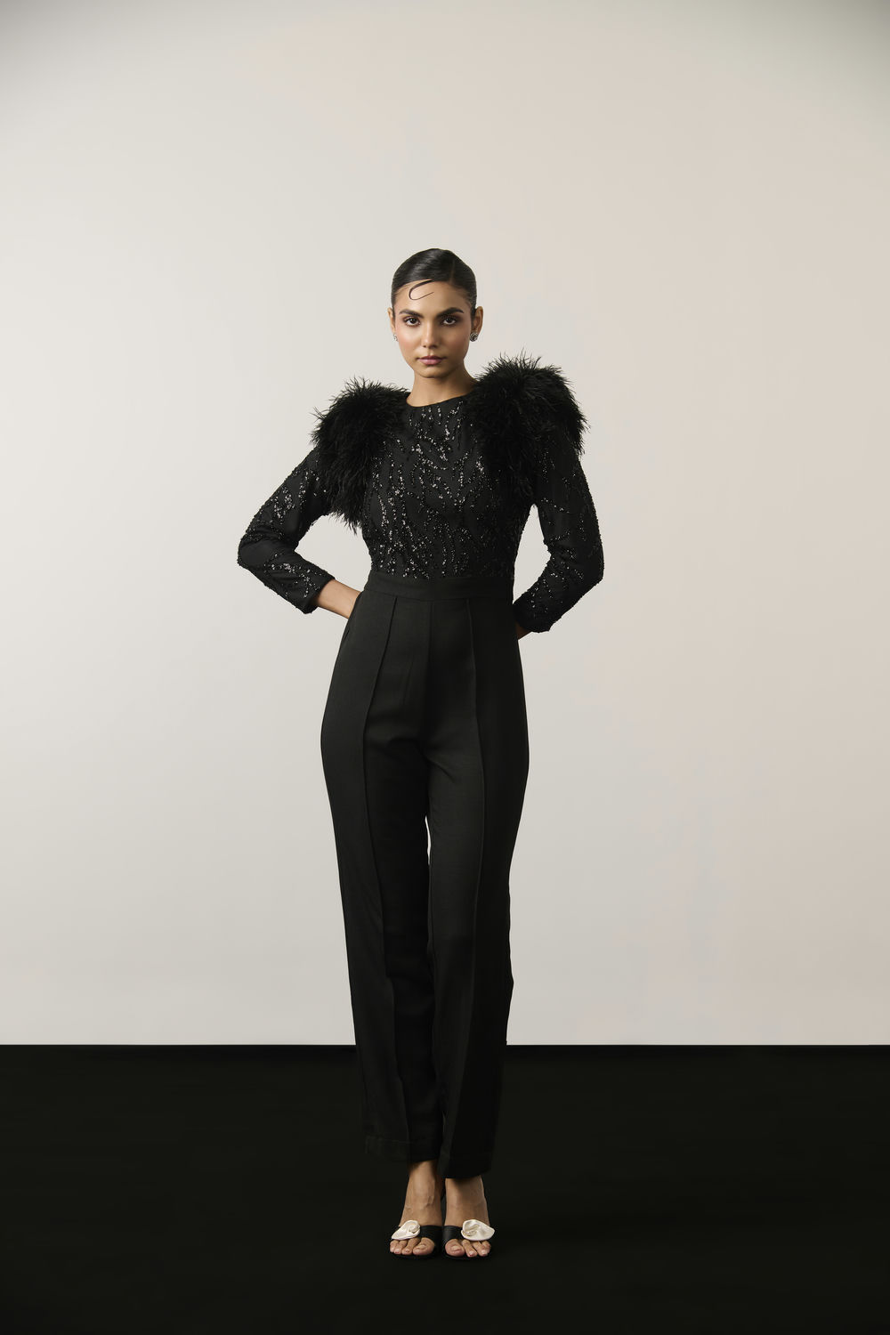BLACK SEQUIN AND FEATHER JUMPSUIT