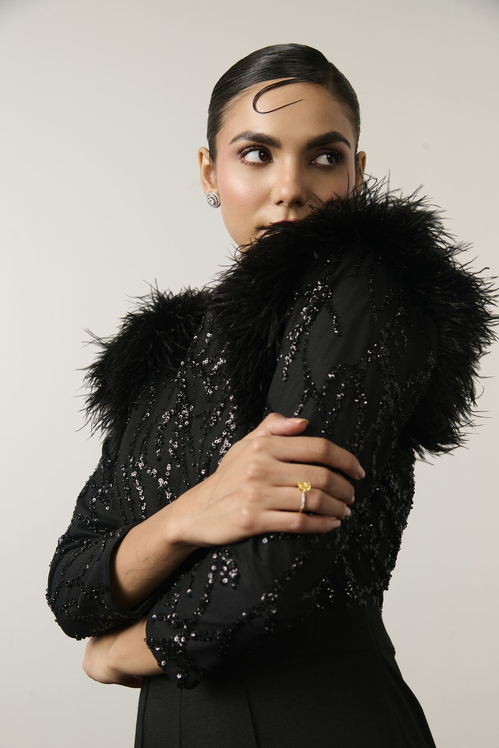 BLACK SEQUIN AND FEATHER JUMPSUIT